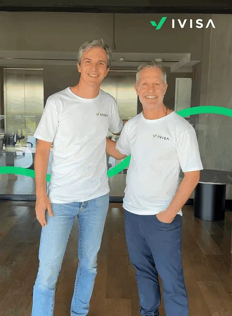 Sergio Merino and David Perez, co-founders of iVisa, celebrating their bootstrapped success and global travel tech growth.