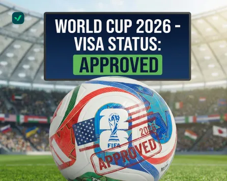 A conceptual graphic featuring a soccer ball decorated with the flags of the host nations (USA, Canada, and Mexico) and the 2026 FIFA logo. A large dark blue header reads "WORLD CUP 2026 - VISA STATUS: APPROVED" with the word "APPROVED" highlighted in a green box. A red "APPROVED" rubber stamp effect is also superimposed directly onto the soccer ball. The background is a blurred stadium filled with spectators under bright lights.